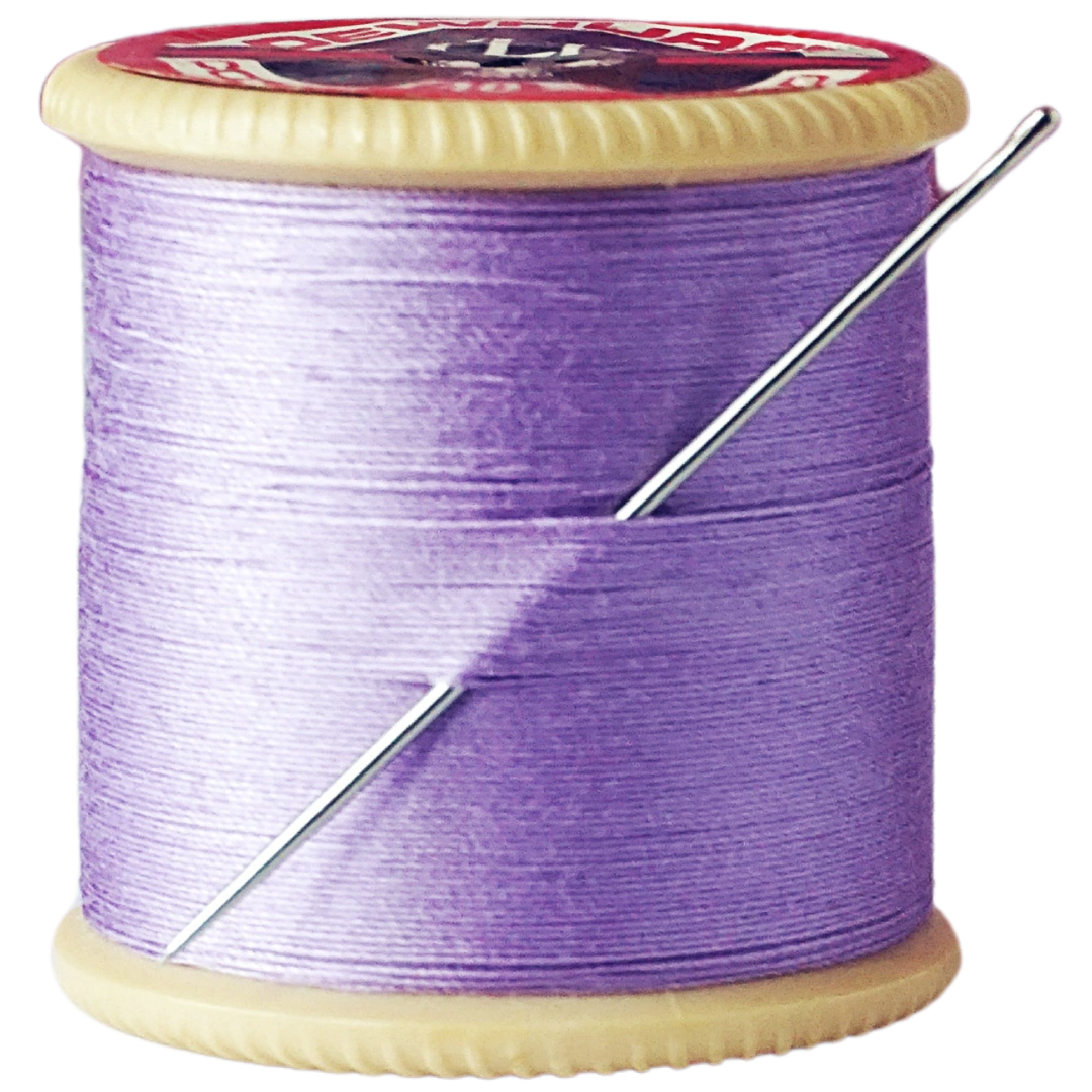 A spool of lavender thread, with a hand-sewing needle stuck through the thread.